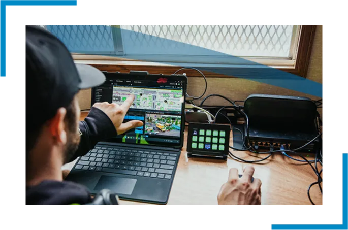 A person pointing at the laptop